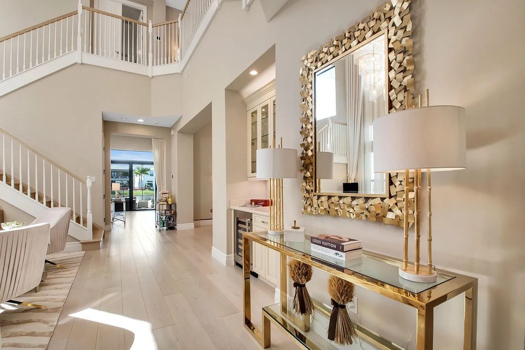 9016 Chauvet Way, Boca Raton, Florida, is built in the highly desired community of Boca Bridges and has more than 5000 square feet. This home is beautifully appointed with custom window treatments, stunning chandeliers, high-end furnishings and glamorous decor throughout.