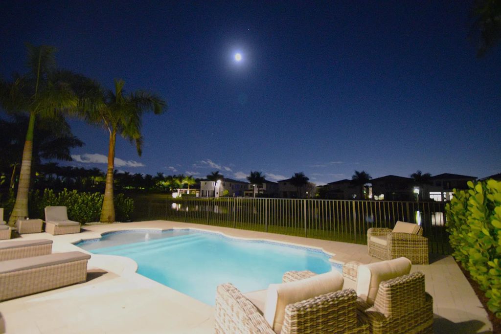 9016 Chauvet Way, Boca Raton, Florida, is built in the highly desired community of Boca Bridges and has more than 5000 square feet. This home is beautifully appointed with custom window treatments, stunning chandeliers, high-end furnishings and glamorous decor throughout.
