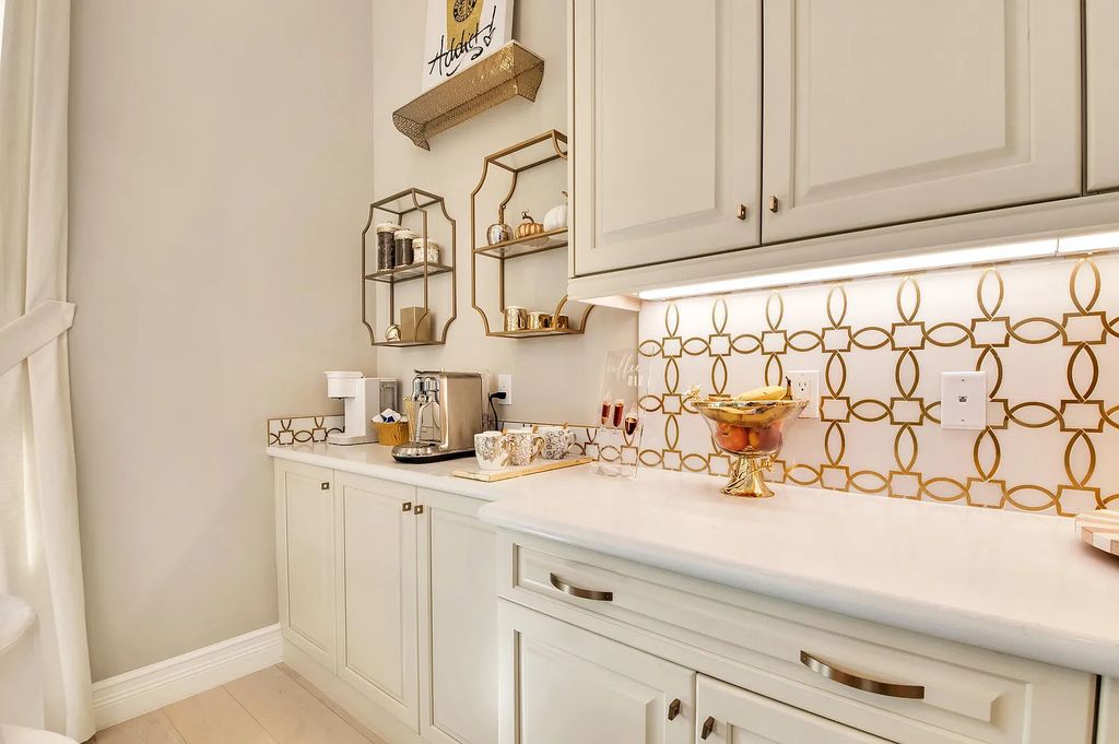 9016 Chauvet Way, Boca Raton, Florida, is built in the highly desired community of Boca Bridges and has more than 5000 square feet. This home is beautifully appointed with custom window treatments, stunning chandeliers, high-end furnishings and glamorous decor throughout.