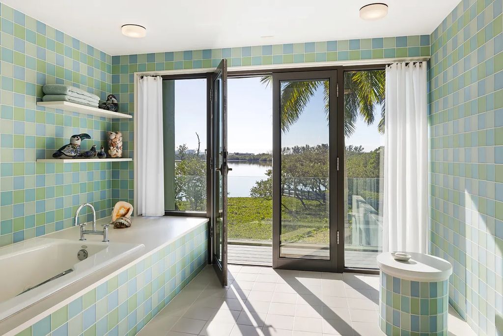 150 Morningside Drive, Sarasota, Florida is a stunning postmodern-style home was designed and built by the renowned architect Don Chapell showcasing the eclectic palette and materials of postmodernism, with an interplay of light and shadow that transforms each space.