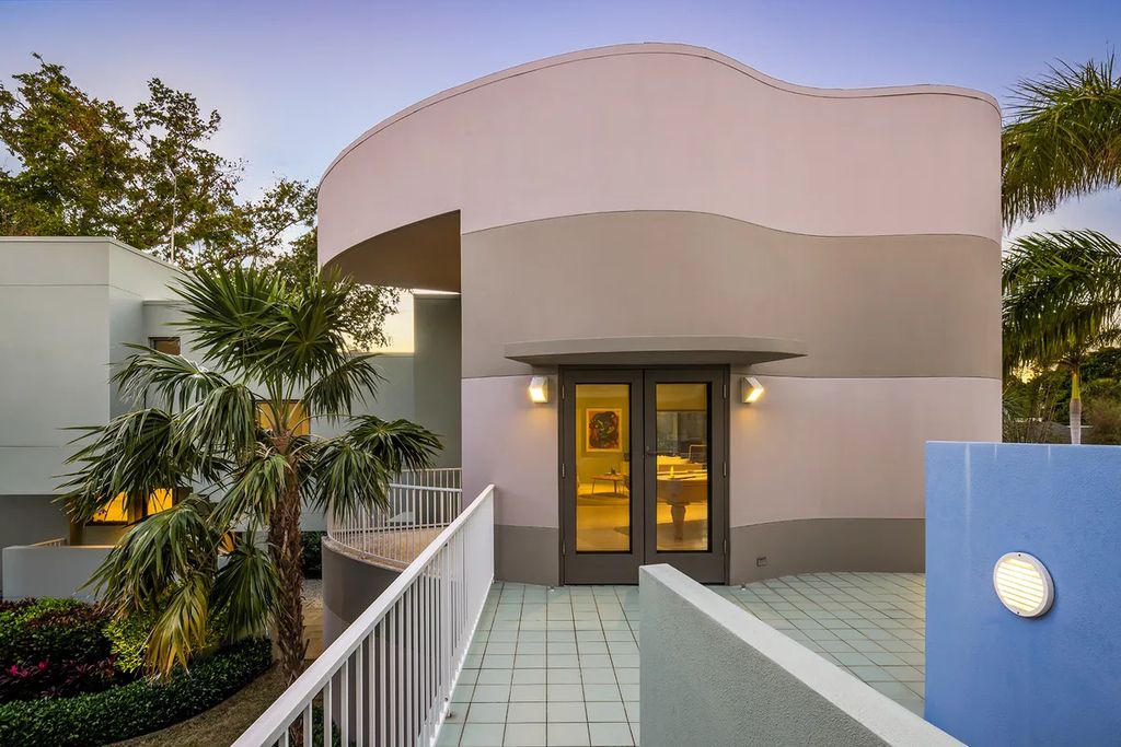 150 Morningside Drive, Sarasota, Florida is a stunning postmodern-style home was designed and built by the renowned architect Don Chapell showcasing the eclectic palette and materials of postmodernism, with an interplay of light and shadow that transforms each space.