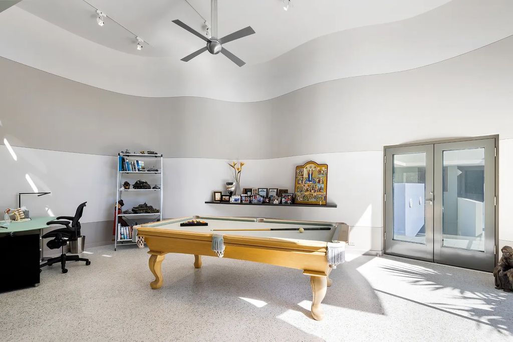150 Morningside Drive, Sarasota, Florida is a stunning postmodern-style home was designed and built by the renowned architect Don Chapell showcasing the eclectic palette and materials of postmodernism, with an interplay of light and shadow that transforms each space.