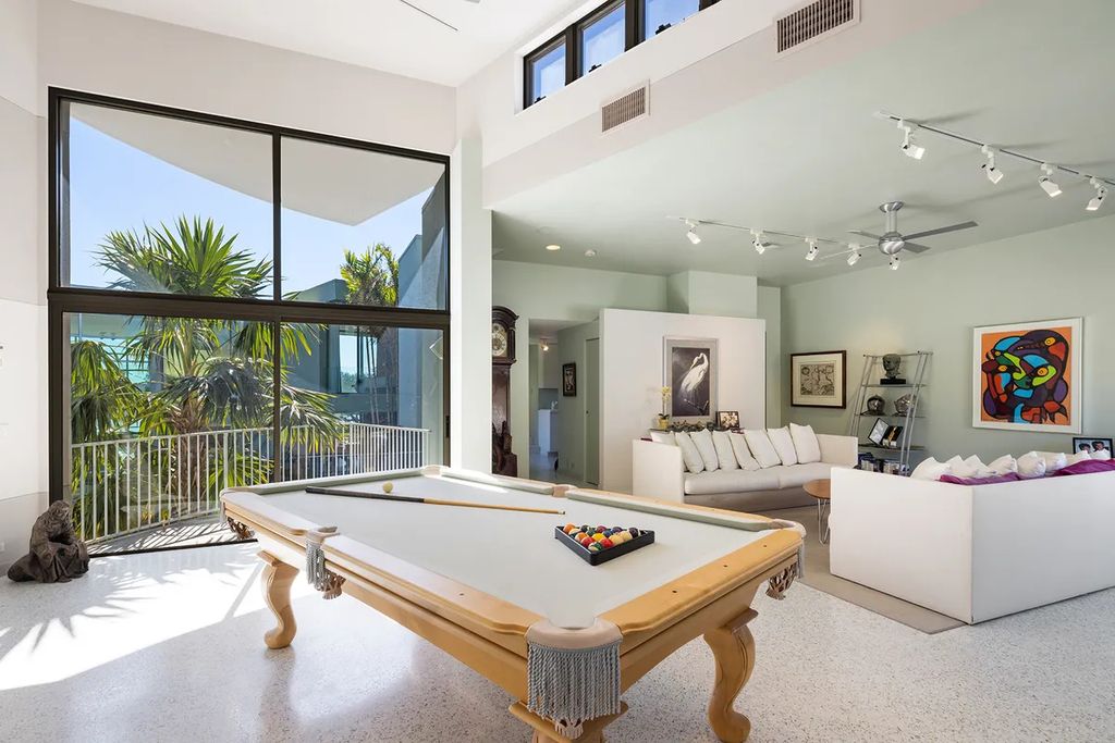 150 Morningside Drive, Sarasota, Florida is a stunning postmodern-style home was designed and built by the renowned architect Don Chapell showcasing the eclectic palette and materials of postmodernism, with an interplay of light and shadow that transforms each space.