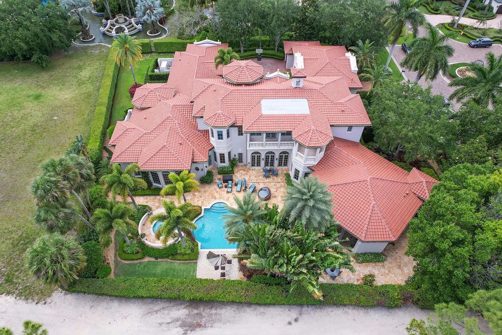 11736 Valeros Court, Palm Beach Gardens, Florida is a special residence in the exclusive Old Palm Golf Club with an amazing array of luxury amenities and design details, amenities include concrete block construction, impact windows and doors, brand new roof, whole home generator, elevator, 5 car garages.