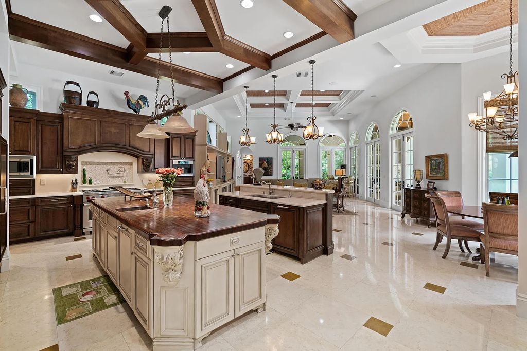 11736 Valeros Court, Palm Beach Gardens, Florida is a special residence in the exclusive Old Palm Golf Club with an amazing array of luxury amenities and design details, amenities include concrete block construction, impact windows and doors, brand new roof, whole home generator, elevator, 5 car garages.