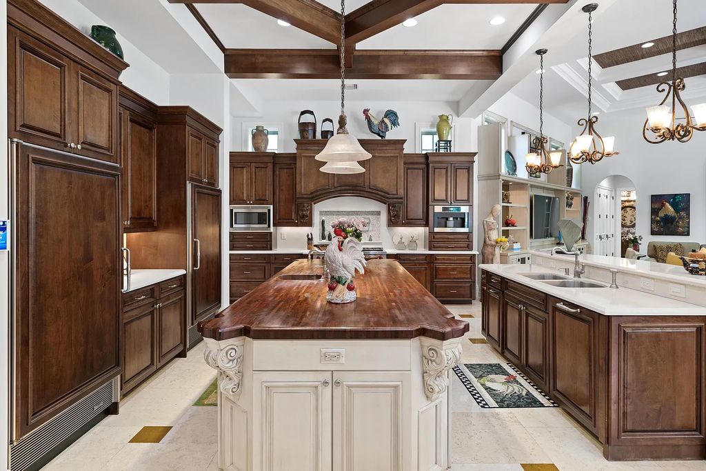 11736 Valeros Court, Palm Beach Gardens, Florida is a special residence in the exclusive Old Palm Golf Club with an amazing array of luxury amenities and design details, amenities include concrete block construction, impact windows and doors, brand new roof, whole home generator, elevator, 5 car garages.