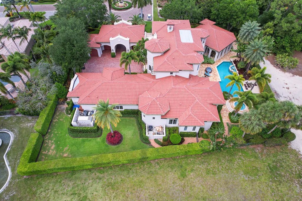 11736 Valeros Court, Palm Beach Gardens, Florida is a special residence in the exclusive Old Palm Golf Club with an amazing array of luxury amenities and design details, amenities include concrete block construction, impact windows and doors, brand new roof, whole home generator, elevator, 5 car garages.