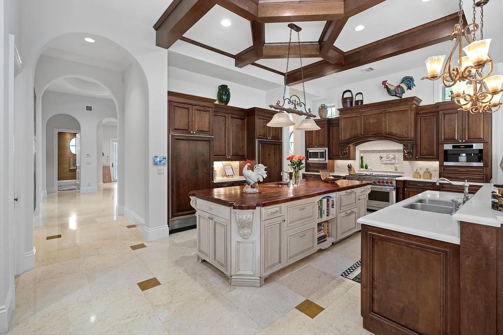 11736 Valeros Court, Palm Beach Gardens, Florida is a special residence in the exclusive Old Palm Golf Club with an amazing array of luxury amenities and design details, amenities include concrete block construction, impact windows and doors, brand new roof, whole home generator, elevator, 5 car garages.