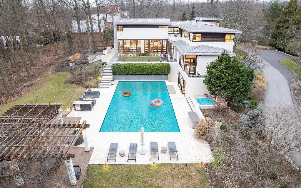 The House in Owings Mill features magnificent wooded views of the 2+ acre site plus 33 or more acres of open space in the valley beyond, now available for sale. This home located at 1 Huntersworth Ct, Owings Mills, Maryland