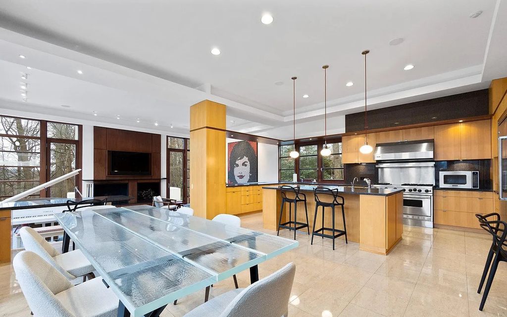 The House in Owings Mill features magnificent wooded views of the 2+ acre site plus 33 or more acres of open space in the valley beyond, now available for sale. This home located at 1 Huntersworth Ct, Owings Mills, Maryland
