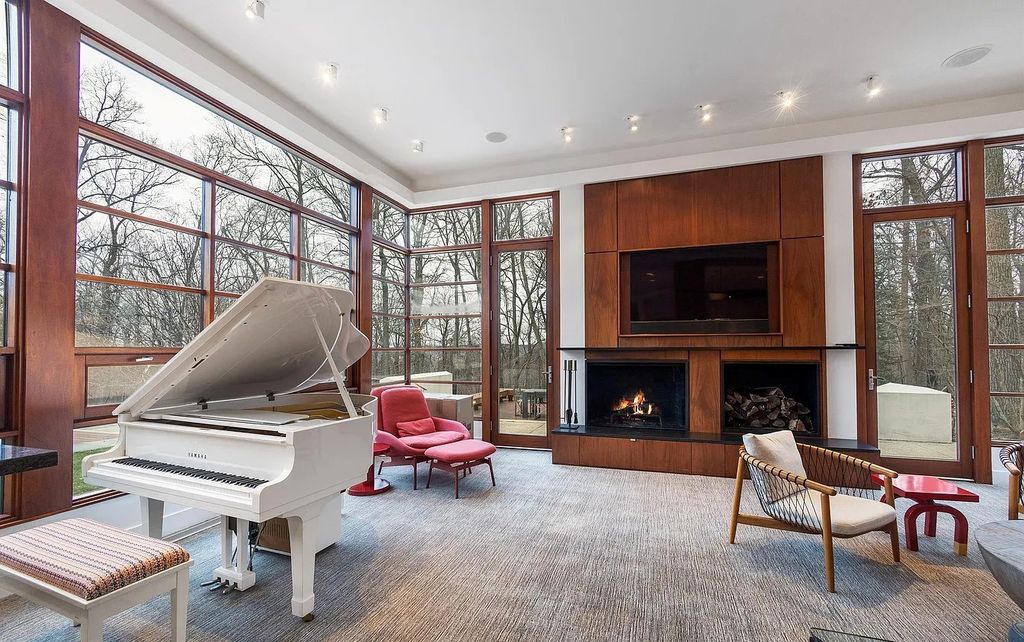 The House in Owings Mill features magnificent wooded views of the 2+ acre site plus 33 or more acres of open space in the valley beyond, now available for sale. This home located at 1 Huntersworth Ct, Owings Mills, Maryland