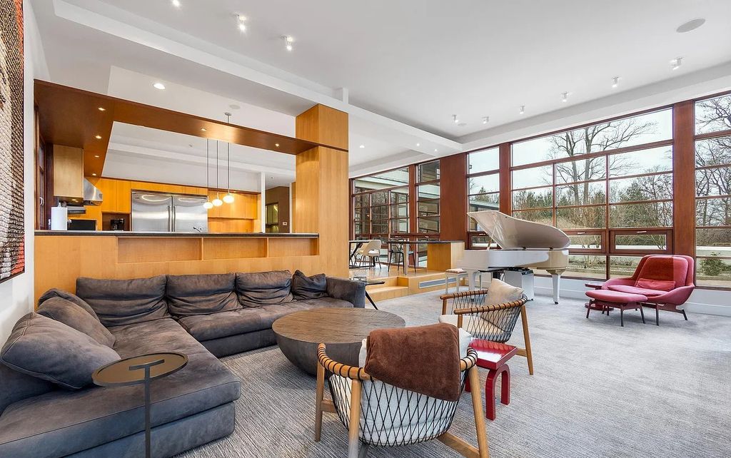 The House in Owings Mill features magnificent wooded views of the 2+ acre site plus 33 or more acres of open space in the valley beyond, now available for sale. This home located at 1 Huntersworth Ct, Owings Mills, Maryland