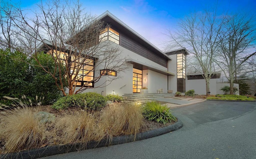 The House in Owings Mill features magnificent wooded views of the 2+ acre site plus 33 or more acres of open space in the valley beyond, now available for sale. This home located at 1 Huntersworth Ct, Owings Mills, Maryland