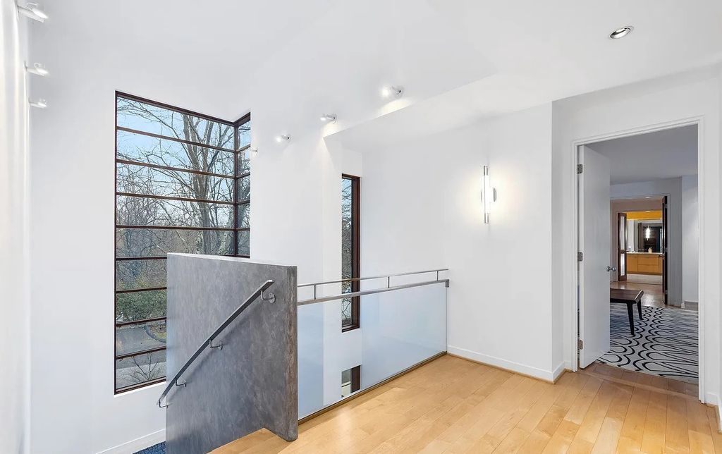 The House in Owings Mill features magnificent wooded views of the 2+ acre site plus 33 or more acres of open space in the valley beyond, now available for sale. This home located at 1 Huntersworth Ct, Owings Mills, Maryland