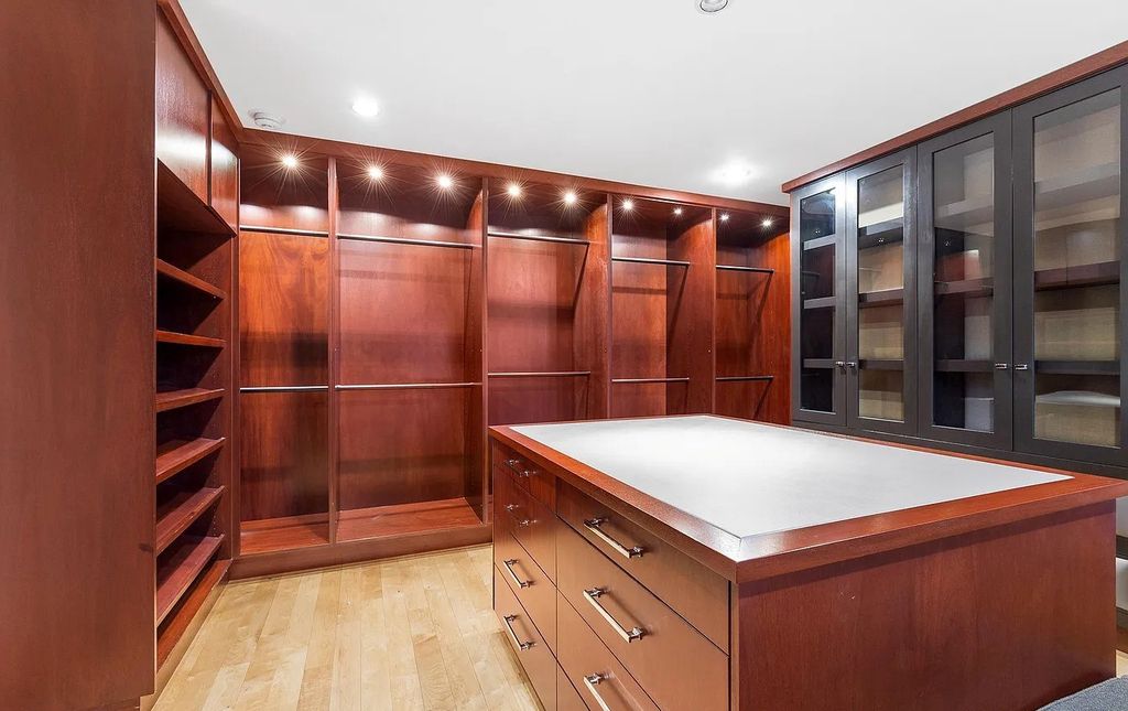 The House in Owings Mill features magnificent wooded views of the 2+ acre site plus 33 or more acres of open space in the valley beyond, now available for sale. This home located at 1 Huntersworth Ct, Owings Mills, Maryland