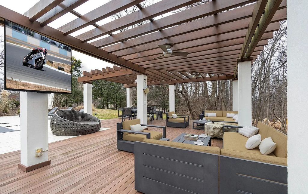 The House in Owings Mill features magnificent wooded views of the 2+ acre site plus 33 or more acres of open space in the valley beyond, now available for sale. This home located at 1 Huntersworth Ct, Owings Mills, Maryland