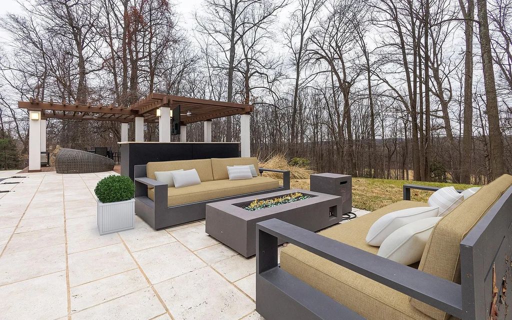 The House in Owings Mill features magnificent wooded views of the 2+ acre site plus 33 or more acres of open space in the valley beyond, now available for sale. This home located at 1 Huntersworth Ct, Owings Mills, Maryland