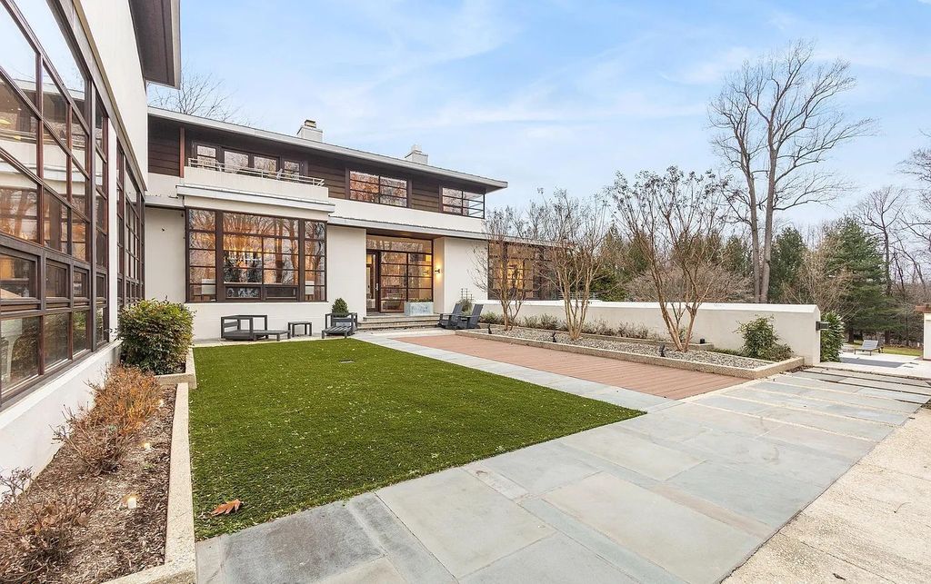 The House in Owings Mill features magnificent wooded views of the 2+ acre site plus 33 or more acres of open space in the valley beyond, now available for sale. This home located at 1 Huntersworth Ct, Owings Mills, Maryland