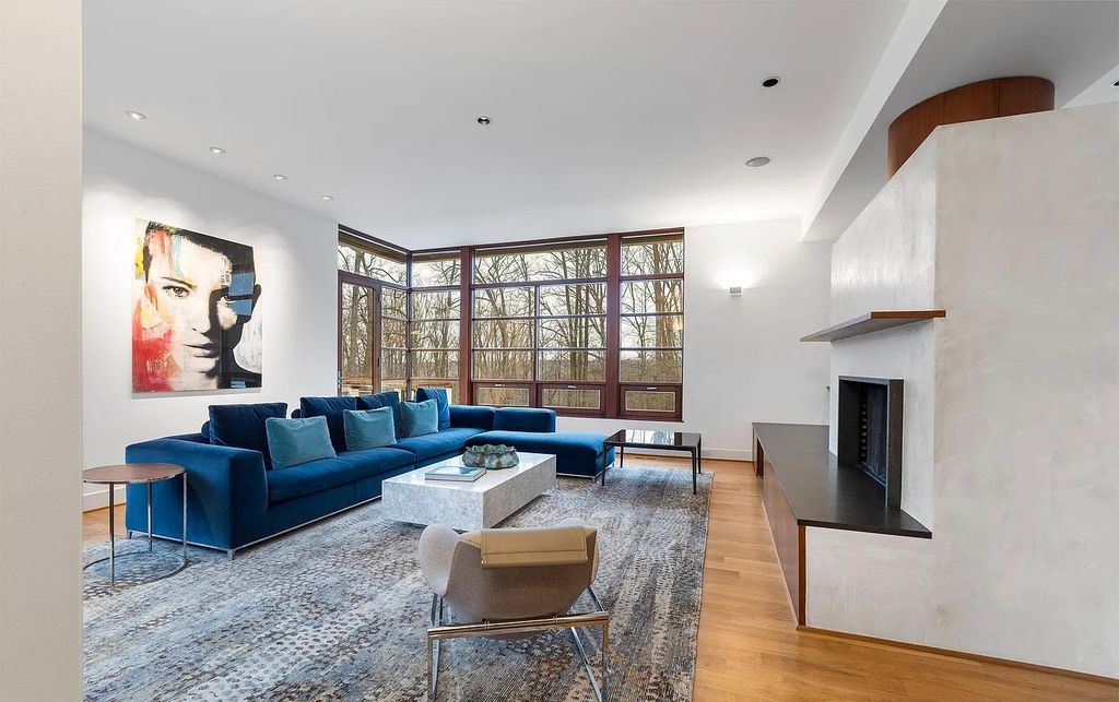 The House in Owings Mill features magnificent wooded views of the 2+ acre site plus 33 or more acres of open space in the valley beyond, now available for sale. This home located at 1 Huntersworth Ct, Owings Mills, Maryland