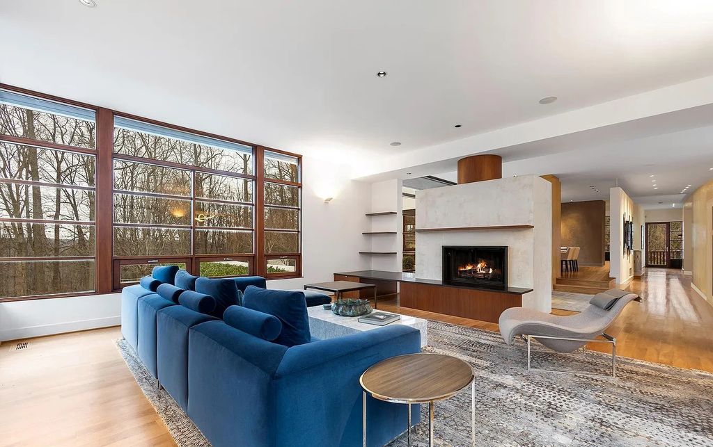 The House in Owings Mill features magnificent wooded views of the 2+ acre site plus 33 or more acres of open space in the valley beyond, now available for sale. This home located at 1 Huntersworth Ct, Owings Mills, Maryland