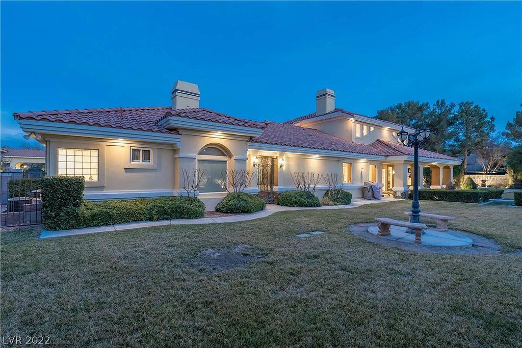 7600 Silver Meadow Court, Las Vegas, Nevada is a resort style estate in an exclusive gated enclave with a generous circular drive, a spacious living room punctuated by a stunning wrought iron floating staircase, a gourmet kitchen, venetian gardens, resort guest house and more.