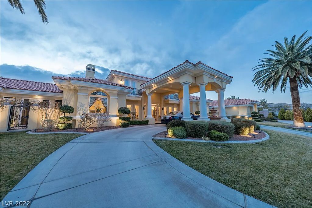 7600 Silver Meadow Court, Las Vegas, Nevada is a resort style estate in an exclusive gated enclave with a generous circular drive, a spacious living room punctuated by a stunning wrought iron floating staircase, a gourmet kitchen, venetian gardens, resort guest house and more.