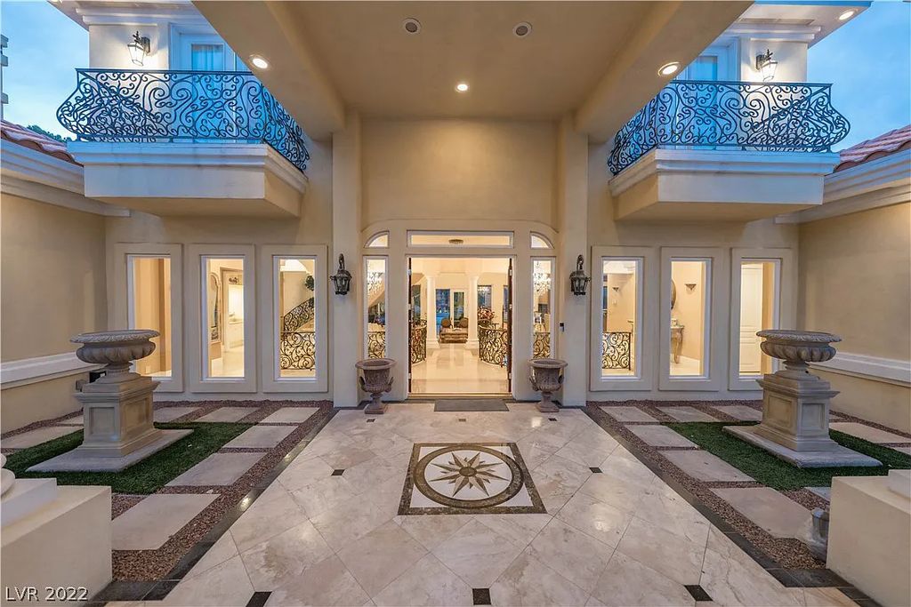 7600 Silver Meadow Court, Las Vegas, Nevada is a resort style estate in an exclusive gated enclave with a generous circular drive, a spacious living room punctuated by a stunning wrought iron floating staircase, a gourmet kitchen, venetian gardens, resort guest house and more.