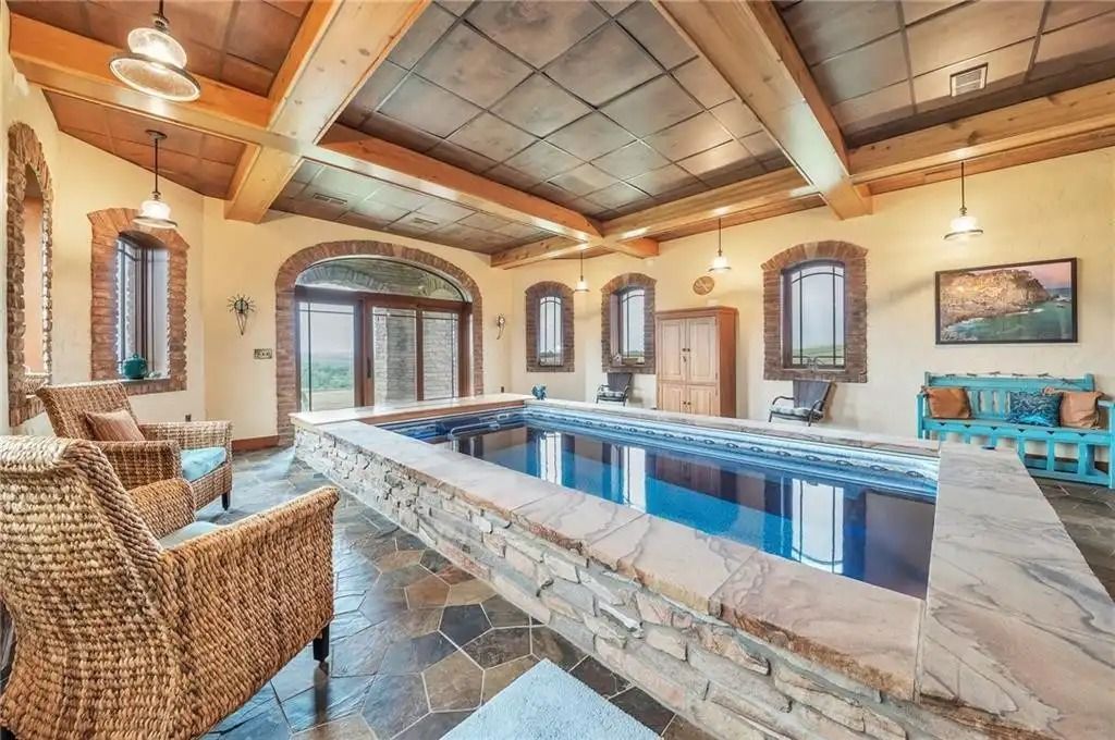 The Estate in Punxsutawney is a luxurious home that greets you by its unique architecture and design at every turn now available for sale. This home located at 34 Chapman Rd, Punxsutawney, Pennsylvania; offering 03 bedrooms and 08 bathrooms with 11,000 square feet of living spaces. 