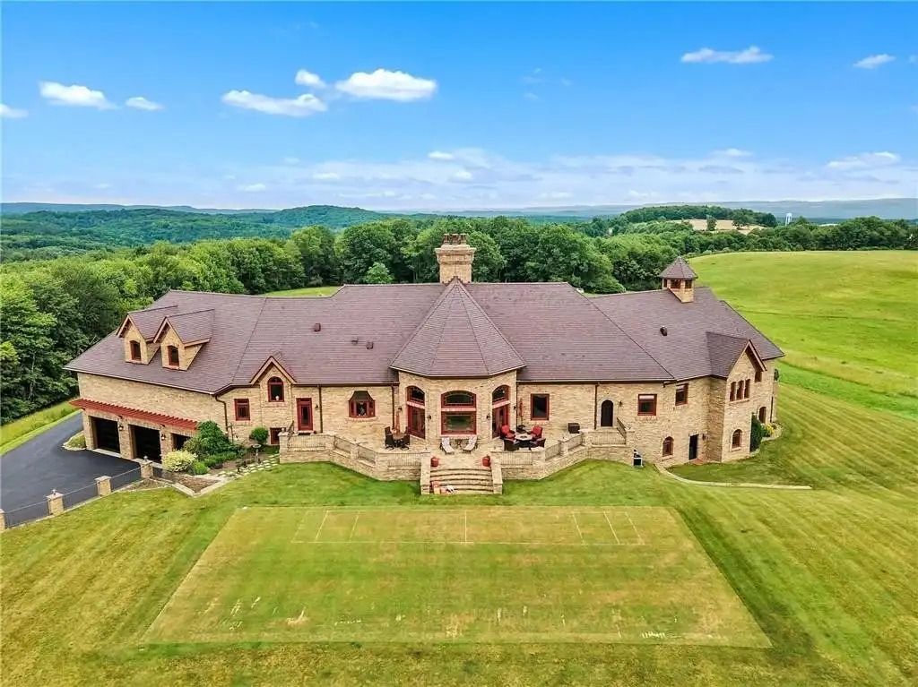 The Estate in Punxsutawney is a luxurious home that greets you by its unique architecture and design at every turn now available for sale. This home located at 34 Chapman Rd, Punxsutawney, Pennsylvania; offering 03 bedrooms and 08 bathrooms with 11,000 square feet of living spaces. 