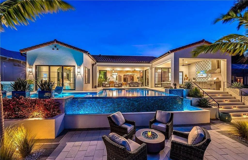 5661 Riverside Drive, Cape Coral, Florida is a meticulously maintained property with uncompromising quality include white oak flooring throughout, PGT aluminum Impact windows and doors, Wolf & Subzero appliances, Pentair filtered water system for water & ice maker in the massive Butler's Pantry with double beverage fridges, Walnut Waterfall Island sitting area, & much more. 
