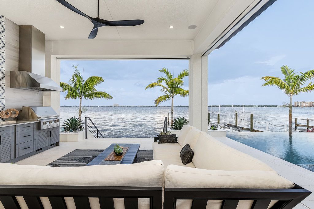 5661 Riverside Drive, Cape Coral, Florida is a meticulously maintained property with uncompromising quality include white oak flooring throughout, PGT aluminum Impact windows and doors, Wolf & Subzero appliances, Pentair filtered water system for water & ice maker in the massive Butler's Pantry with double beverage fridges, Walnut Waterfall Island sitting area, & much more. 