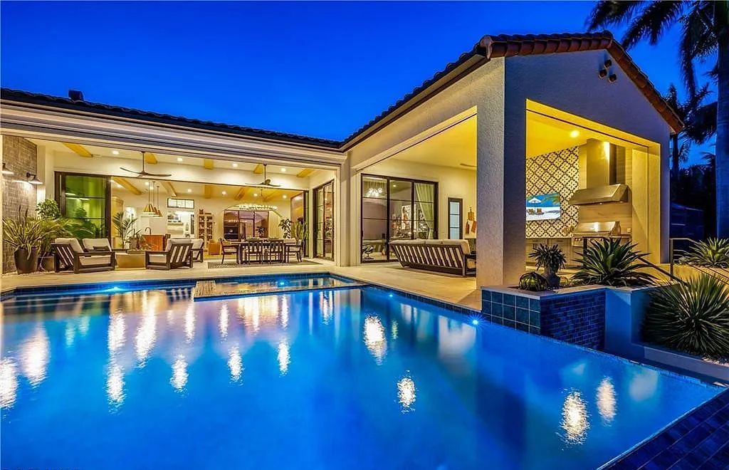 5661 Riverside Drive, Cape Coral, Florida is a meticulously maintained property with uncompromising quality include white oak flooring throughout, PGT aluminum Impact windows and doors, Wolf & Subzero appliances, Pentair filtered water system for water & ice maker in the massive Butler's Pantry with double beverage fridges, Walnut Waterfall Island sitting area, & much more. 