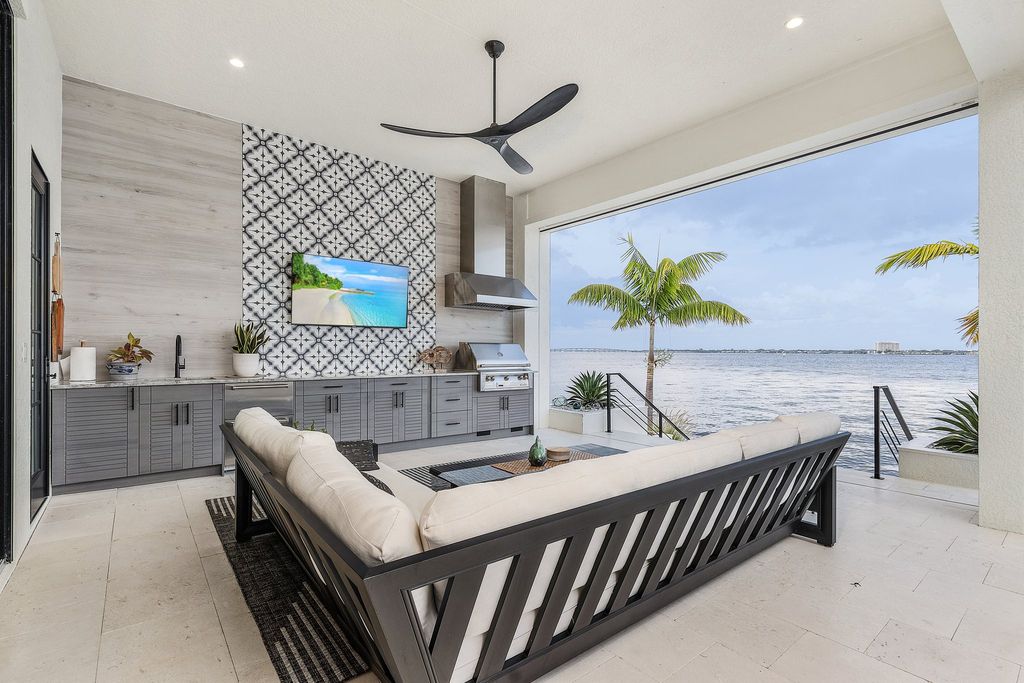 5661 Riverside Drive, Cape Coral, Florida is a meticulously maintained property with uncompromising quality include white oak flooring throughout, PGT aluminum Impact windows and doors, Wolf & Subzero appliances, Pentair filtered water system for water & ice maker in the massive Butler's Pantry with double beverage fridges, Walnut Waterfall Island sitting area, & much more. 
