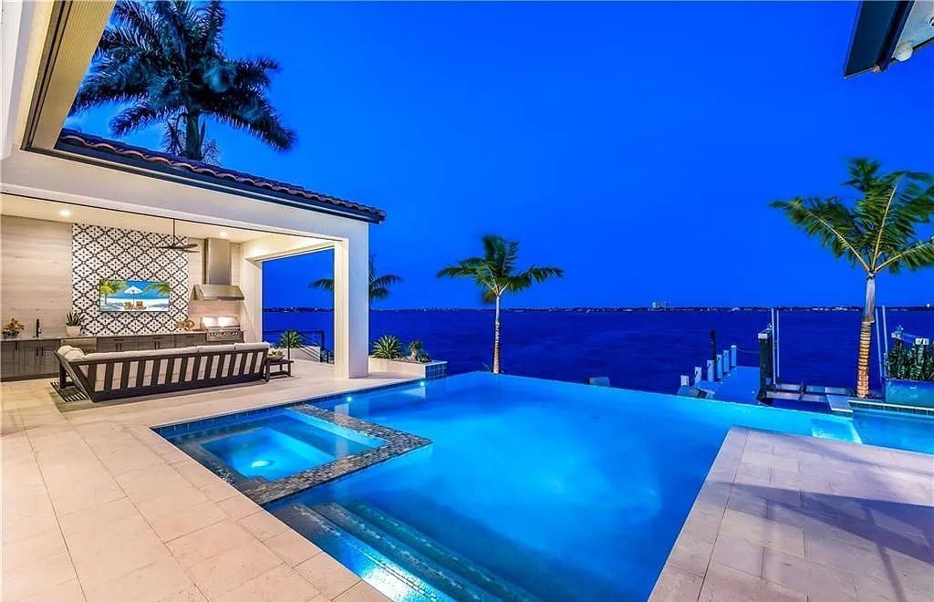 5661 Riverside Drive, Cape Coral, Florida is a meticulously maintained property with uncompromising quality include white oak flooring throughout, PGT aluminum Impact windows and doors, Wolf & Subzero appliances, Pentair filtered water system for water & ice maker in the massive Butler's Pantry with double beverage fridges, Walnut Waterfall Island sitting area, & much more. 
