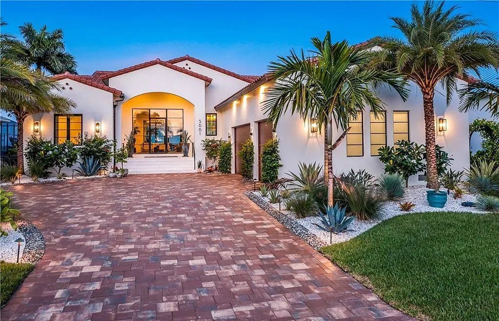5661 Riverside Drive, Cape Coral, Florida is a meticulously maintained property with uncompromising quality include white oak flooring throughout, PGT aluminum Impact windows and doors, Wolf & Subzero appliances, Pentair filtered water system for water & ice maker in the massive Butler's Pantry with double beverage fridges, Walnut Waterfall Island sitting area, & much more. 