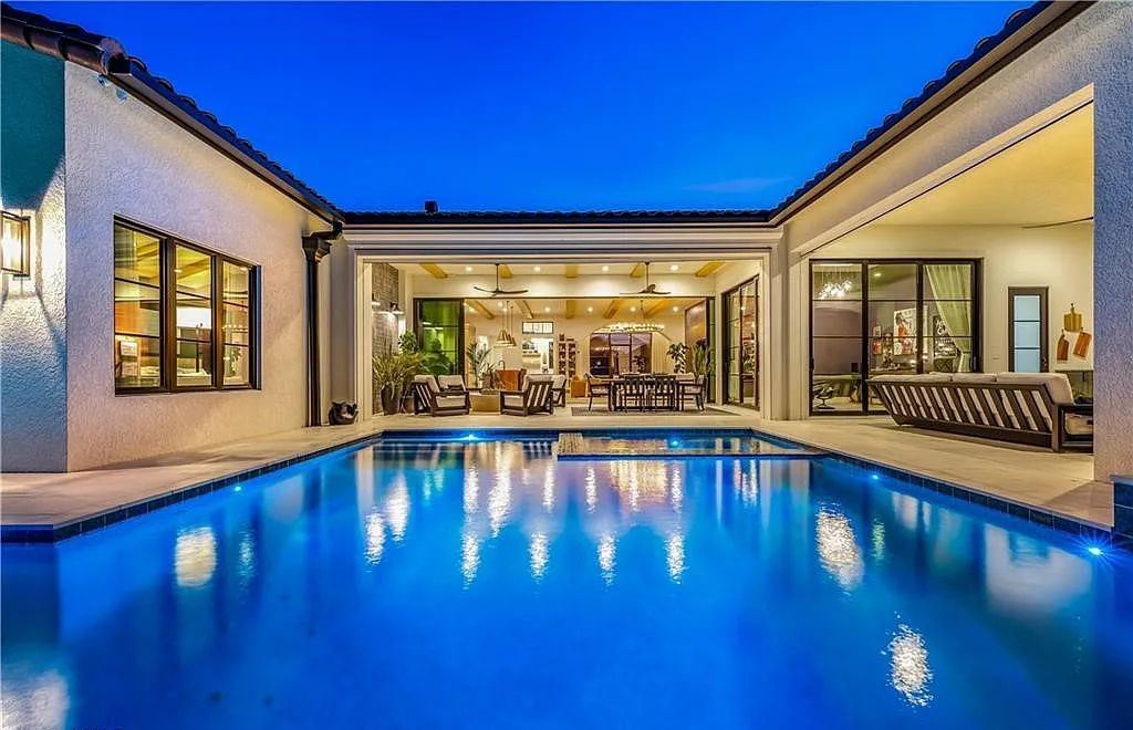 5661 Riverside Drive, Cape Coral, Florida is a meticulously maintained property with uncompromising quality include white oak flooring throughout, PGT aluminum Impact windows and doors, Wolf & Subzero appliances, Pentair filtered water system for water & ice maker in the massive Butler's Pantry with double beverage fridges, Walnut Waterfall Island sitting area, & much more. 