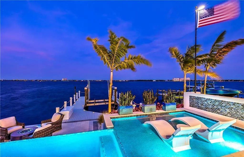5661 Riverside Drive, Cape Coral, Florida is a meticulously maintained property with uncompromising quality include white oak flooring throughout, PGT aluminum Impact windows and doors, Wolf & Subzero appliances, Pentair filtered water system for water & ice maker in the massive Butler's Pantry with double beverage fridges, Walnut Waterfall Island sitting area, & much more. 