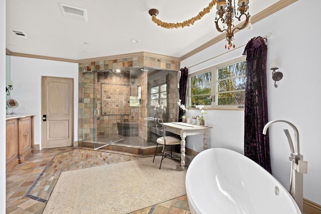 16479 Royal Hills Drive, Encino, California is a true private compound features a stunning main house, luxurious detached guest house, expansive resort type backyard and a unique art inspired swimmers infinity pool and spa that forge an effortless connection with jaw-dropping views.