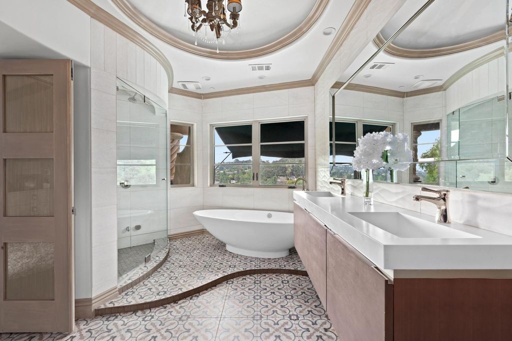 16479 Royal Hills Drive, Encino, California is a true private compound features a stunning main house, luxurious detached guest house, expansive resort type backyard and a unique art inspired swimmers infinity pool and spa that forge an effortless connection with jaw-dropping views.