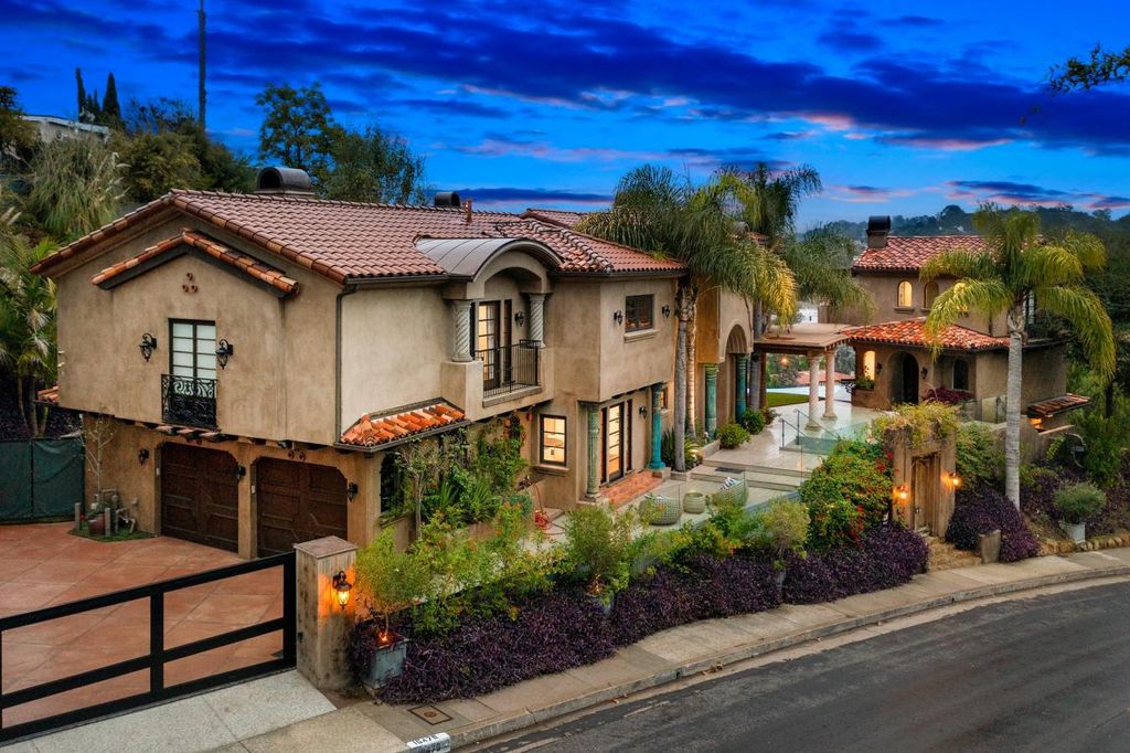 16479 Royal Hills Drive, Encino, California is a true private compound features a stunning main house, luxurious detached guest house, expansive resort type backyard and a unique art inspired swimmers infinity pool and spa that forge an effortless connection with jaw-dropping views.