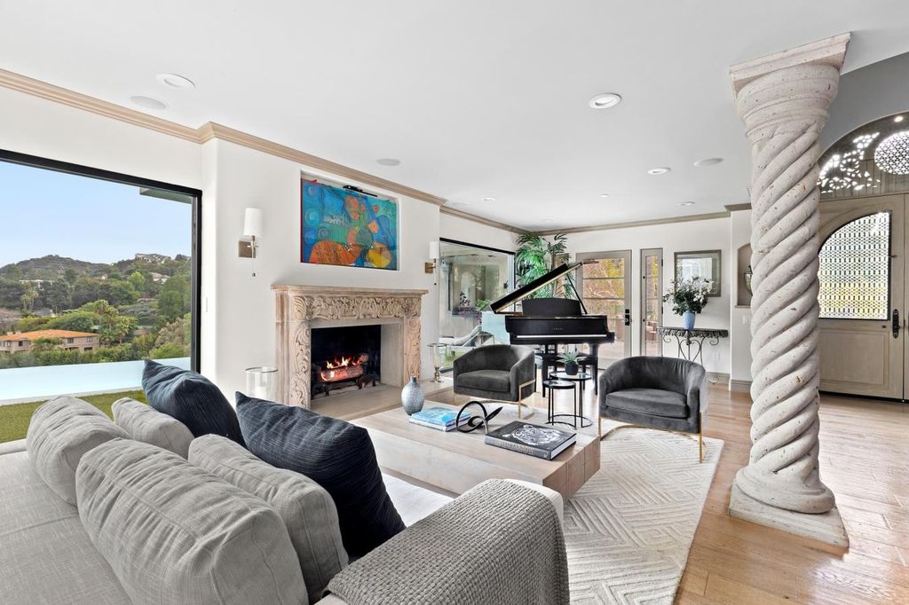 16479 Royal Hills Drive, Encino, California is a true private compound features a stunning main house, luxurious detached guest house, expansive resort type backyard and a unique art inspired swimmers infinity pool and spa that forge an effortless connection with jaw-dropping views.