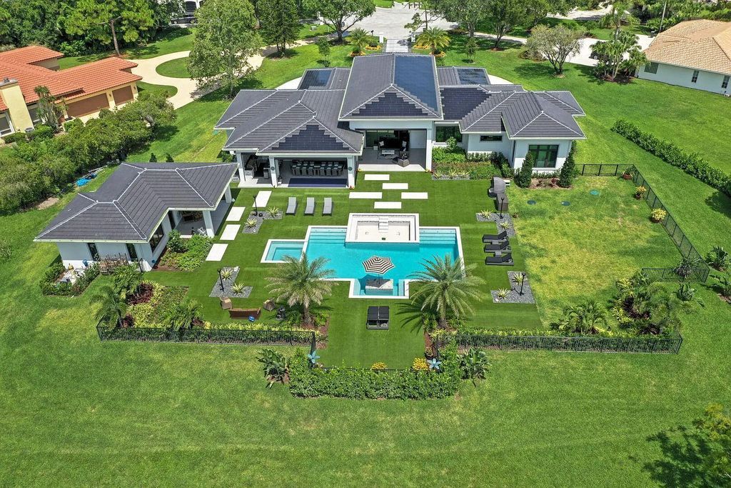 5812 Lady Luck Road, Palm Beach Gardens, Florida, is the finest modern new construction that is available in Steeplechase, one of the most desirable neighborhoods. This wonderful home in South Florida features the crispest modern interior and modern technology, such as the solar roof and Icynene foam insulation.