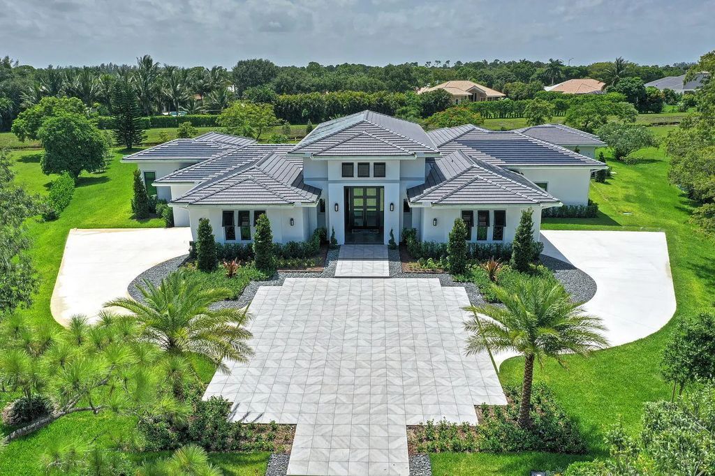 5812 Lady Luck Road, Palm Beach Gardens, Florida, is the finest modern new construction that is available in Steeplechase, one of the most desirable neighborhoods. This wonderful home in South Florida features the crispest modern interior and modern technology, such as the solar roof and Icynene foam insulation.