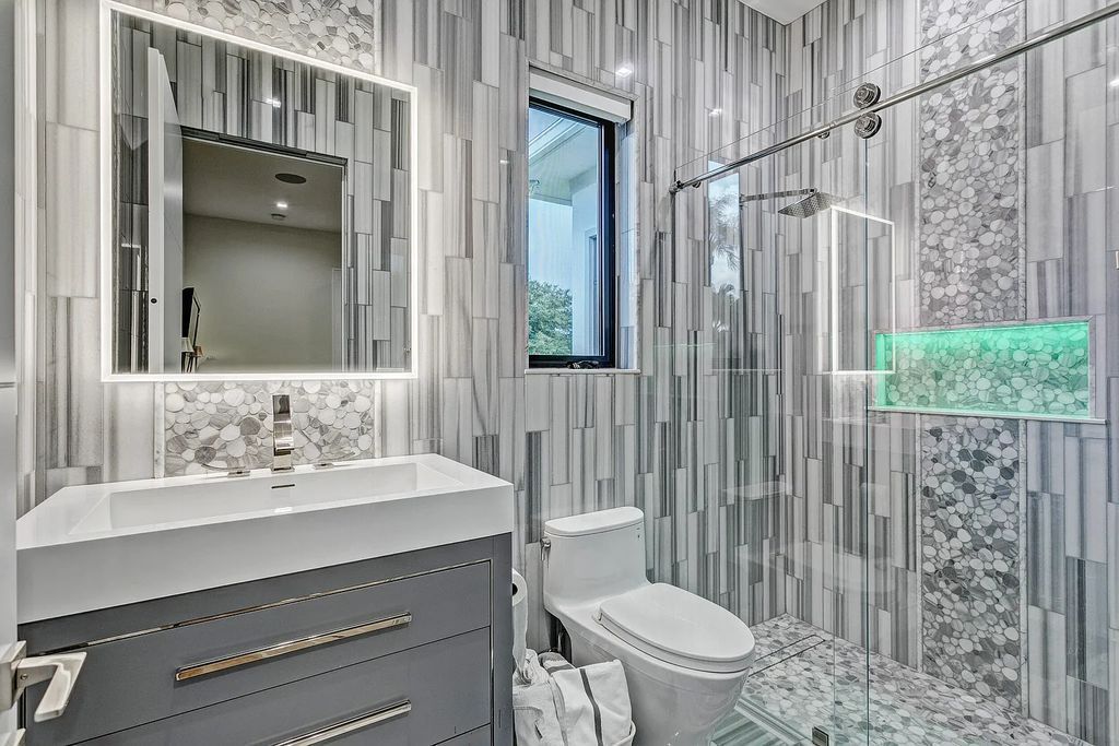 5812 Lady Luck Road, Palm Beach Gardens, Florida, is the finest modern new construction that is available in Steeplechase, one of the most desirable neighborhoods. This wonderful home in South Florida features the crispest modern interior and modern technology, such as the solar roof and Icynene foam insulation.