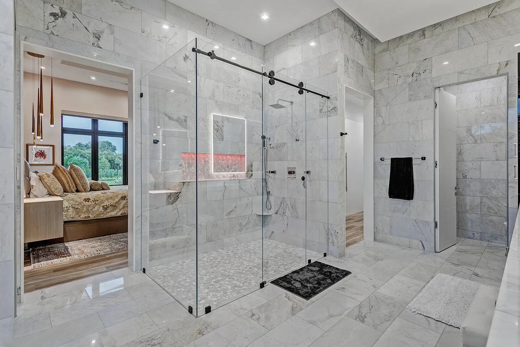 5812 Lady Luck Road, Palm Beach Gardens, Florida, is the finest modern new construction that is available in Steeplechase, one of the most desirable neighborhoods. This wonderful home in South Florida features the crispest modern interior and modern technology, such as the solar roof and Icynene foam insulation.