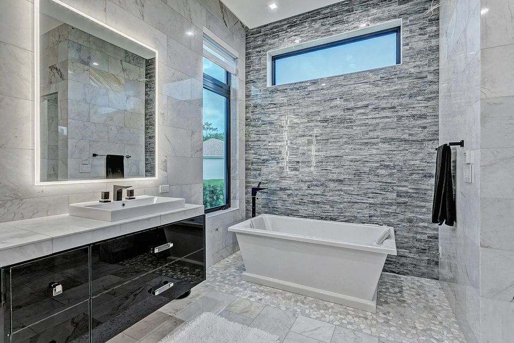 5812 Lady Luck Road, Palm Beach Gardens, Florida, is the finest modern new construction that is available in Steeplechase, one of the most desirable neighborhoods. This wonderful home in South Florida features the crispest modern interior and modern technology, such as the solar roof and Icynene foam insulation.