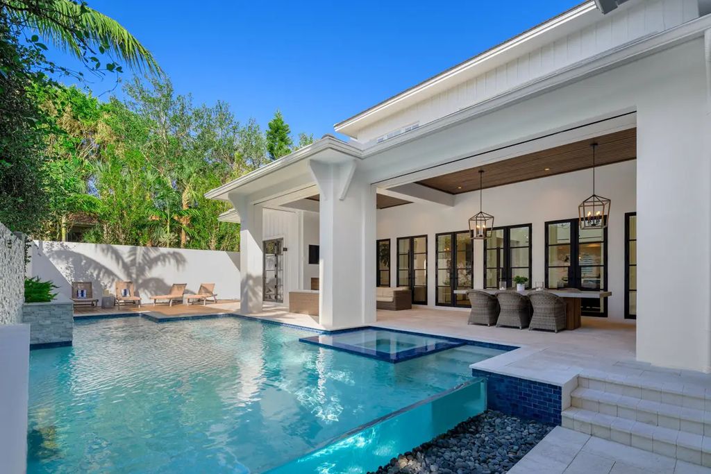 9201 Mercato Way, Naples, Florida is a magnificent gem in the heart of the Residences at Mercato just minutes from the famous Vanderbilt Beach with a custom outdoor oasis, an open floor plan, and designer touches throughout.