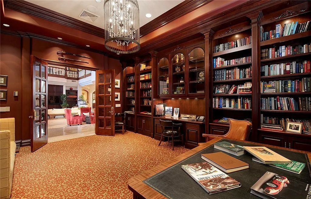 8920 Players Club Drive, Las Vegas, Nevada is a sprawling estate designed for entertaining on a grand scale with soaring ceiling heights, expansive entry, and ornate marble and carpet floor patterns.