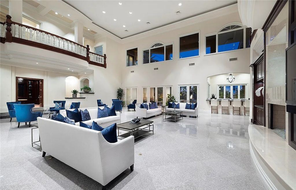 8920 Players Club Drive, Las Vegas, Nevada is a sprawling estate designed for entertaining on a grand scale with soaring ceiling heights, expansive entry, and ornate marble and carpet floor patterns.