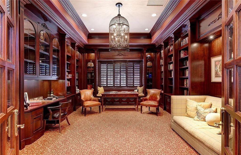 8920 Players Club Drive, Las Vegas, Nevada is a sprawling estate designed for entertaining on a grand scale with soaring ceiling heights, expansive entry, and ornate marble and carpet floor patterns.
